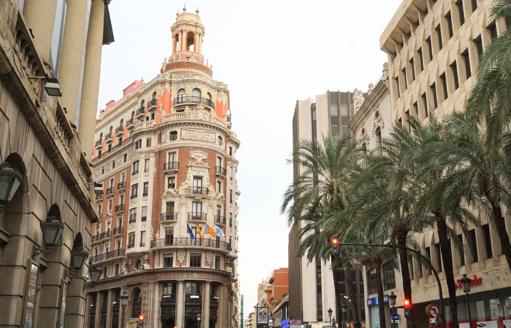 Street lined with Spanish style buildings and palm trees