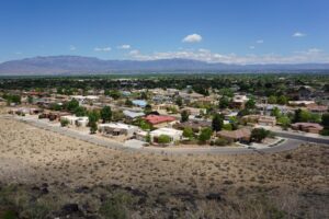 Overhead view of neighborhood in Albuquerque New Mexico with mountain range in the background