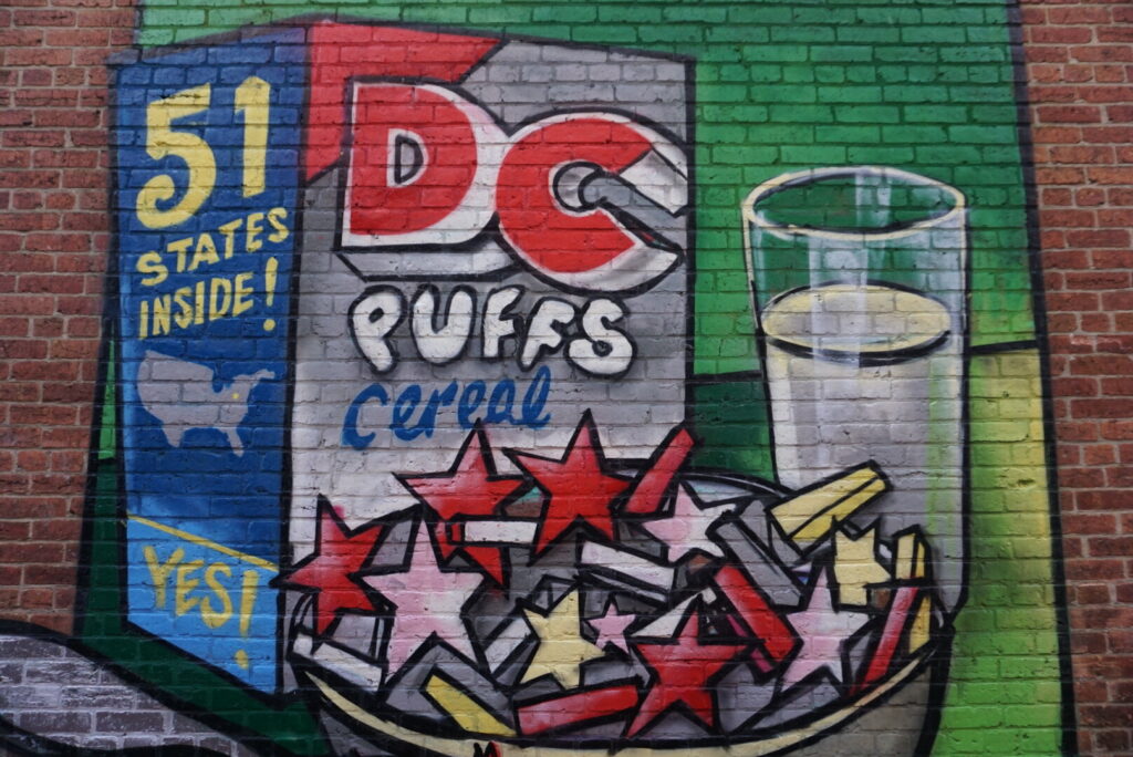 Washington DC street mural with a cereal box called DC Puffs
