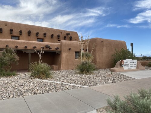 Brown adobe building housing the White Sands Visitors Center in New Mexico