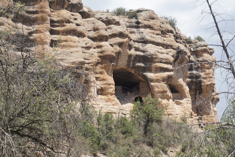 Cliff dwellings in New Mexico mountain seen from a distance