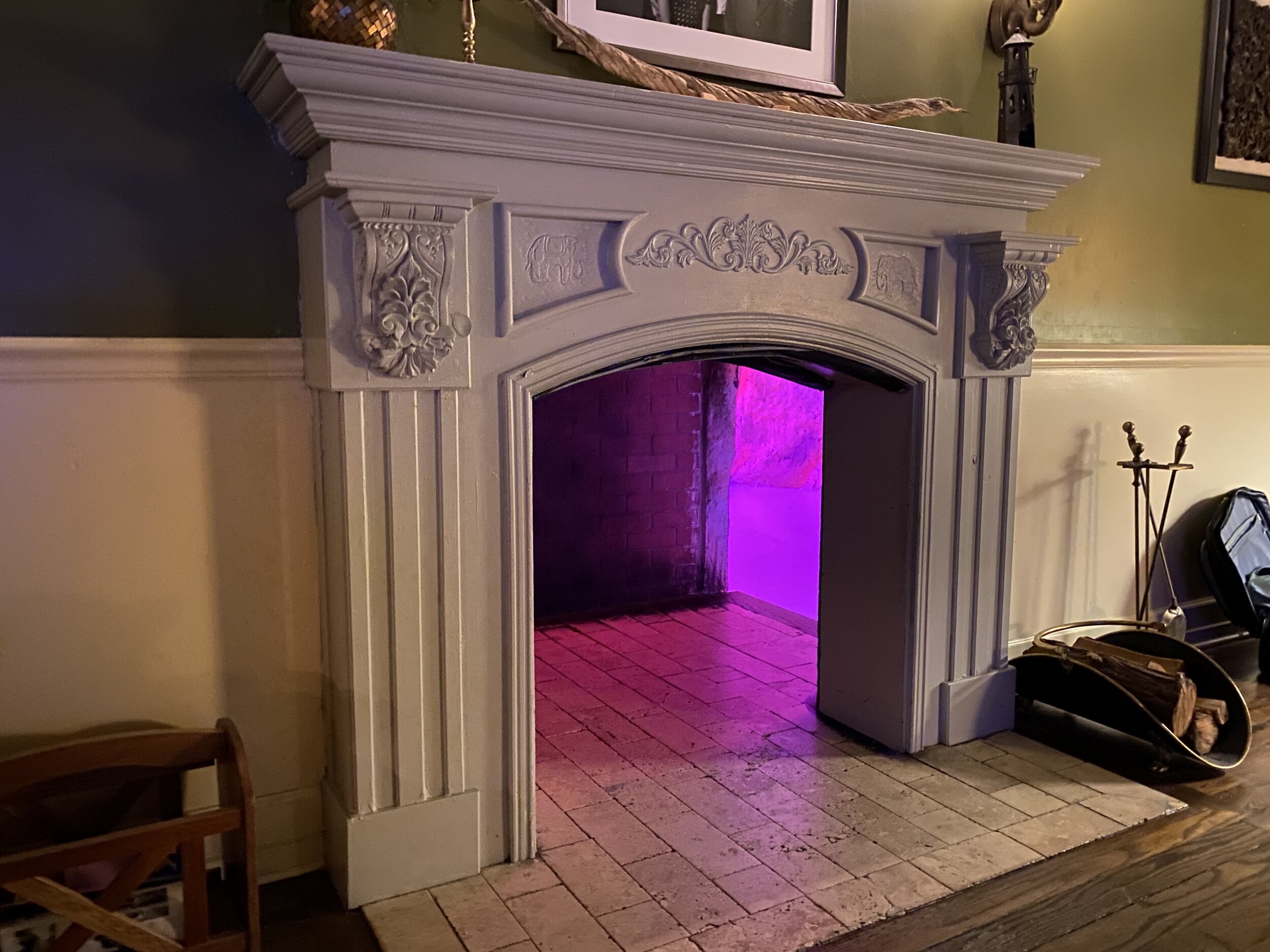 Fireplace with purple light shining out of it