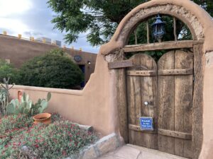 Wooden double door for outdoor patio in historic Southwestern style in New Mexico