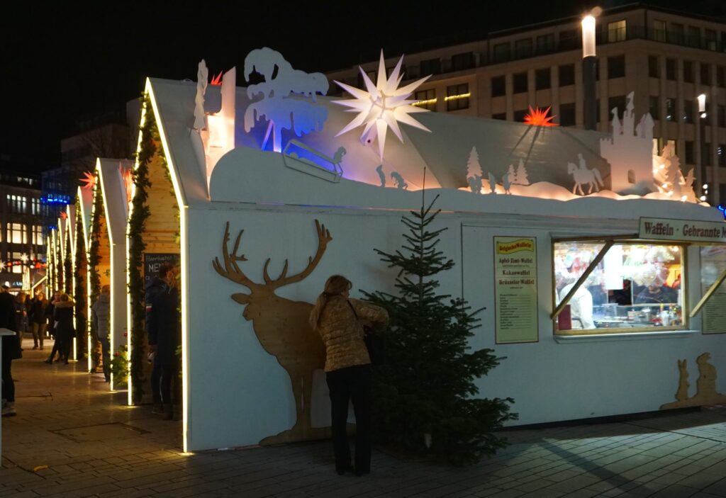 Fairytale-themed white Christmas market booths in Cologne, Germany