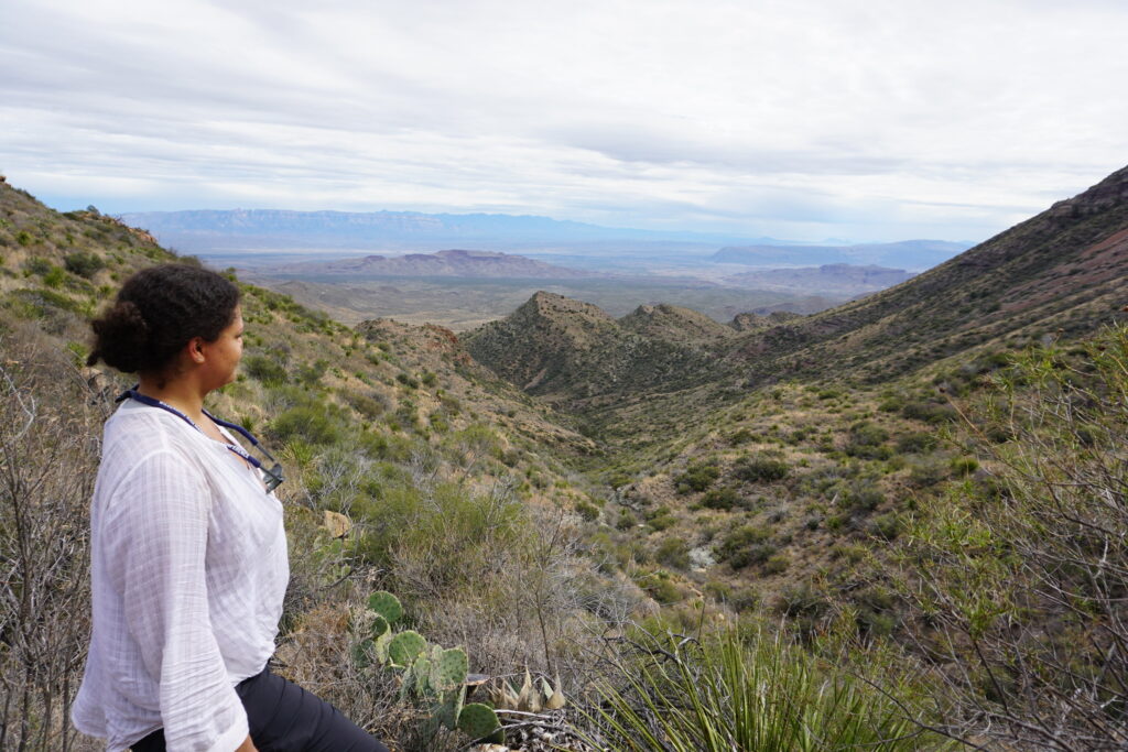 Woman looking out on a Texas desert valley