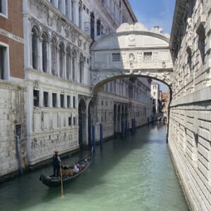 Gondola passing under the Bridge of Sighs in Venice Italy