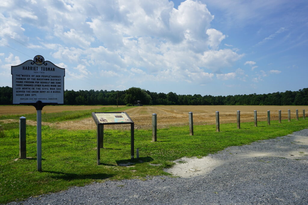 An empty field with historical placard that's the site of the former farm where Harriet Tubman was enslaved.