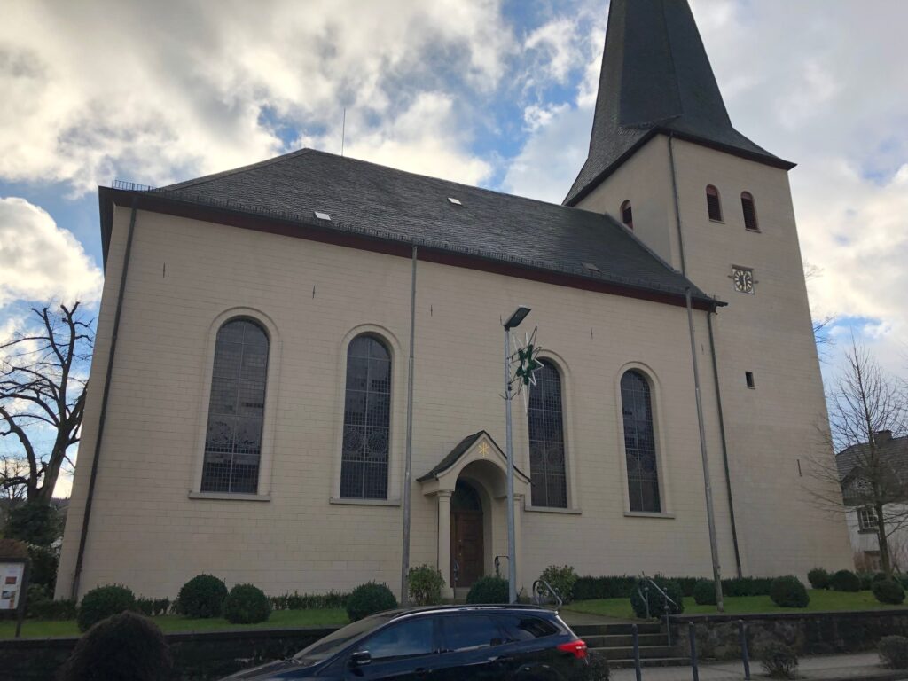 Beige church with a chapel in Neuenrade Germany