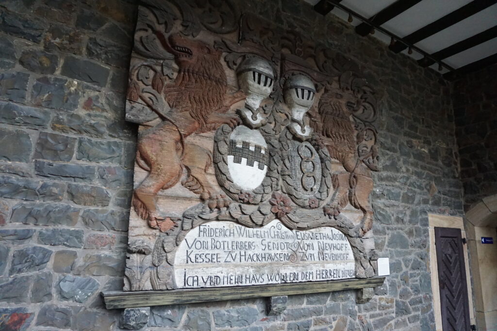 Carved wooden art on a wall in Altena Castle in Germany