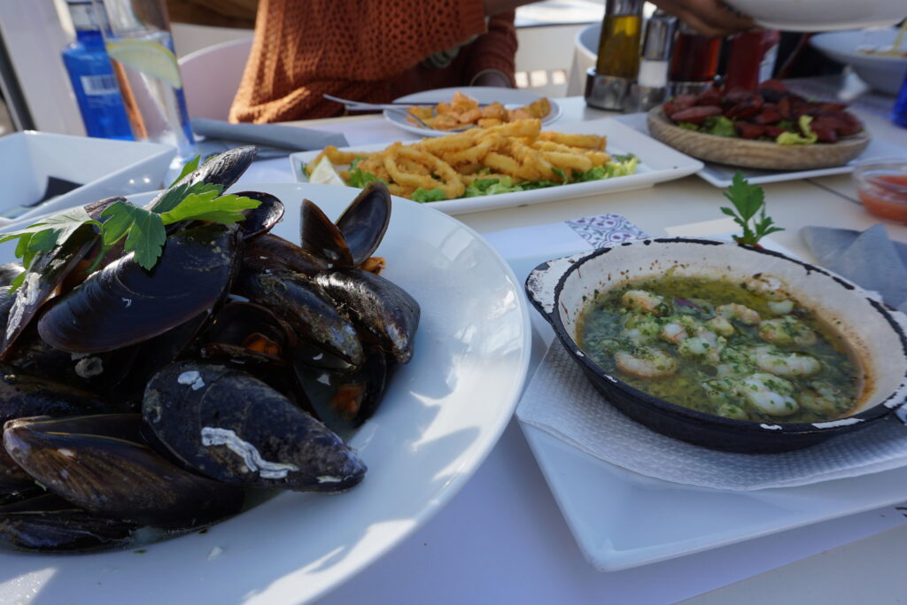 Table with plates of Mediterranean seafood in Spain