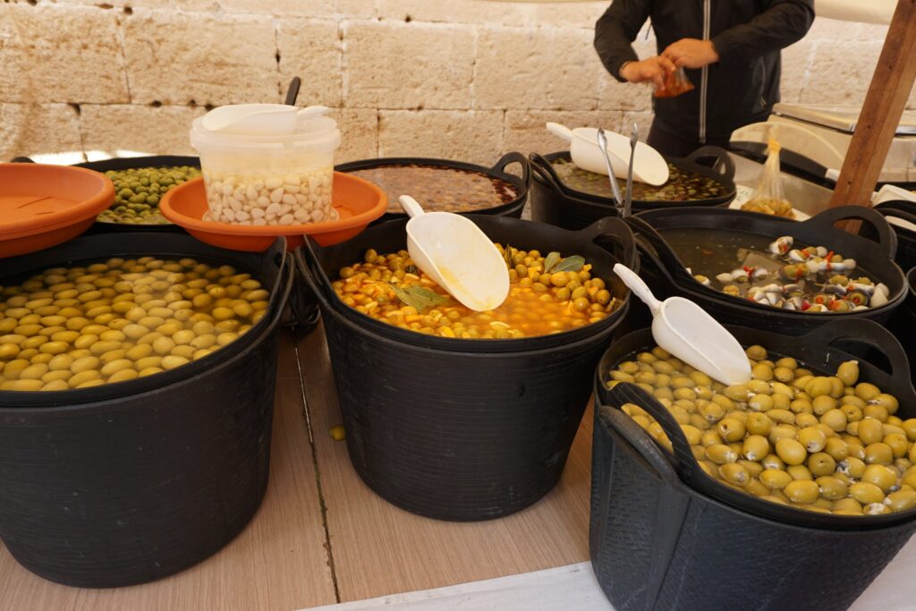 Buckets of marinated Spanish olives at a market in Javea Spain