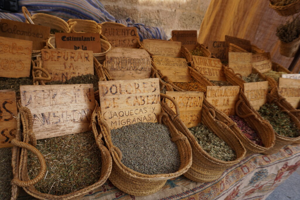 Woven baskets of loose leaf teas at an outdoor market in Javea Spain