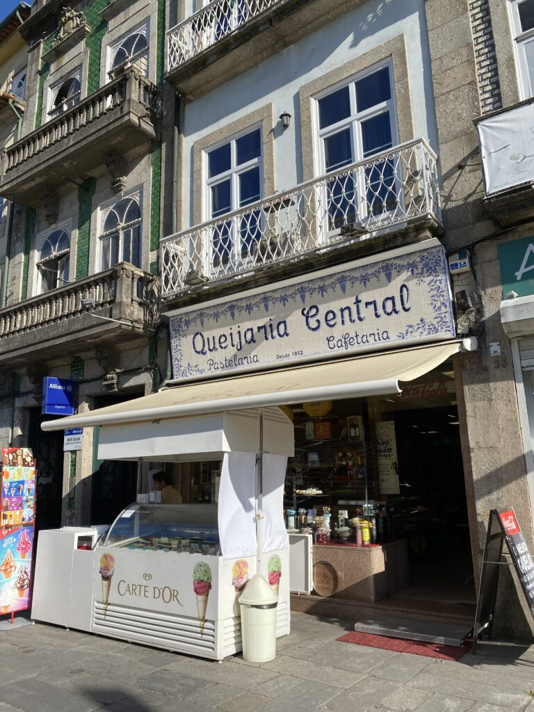 Dessert shop with Portuguese tile sign and ice cream stand