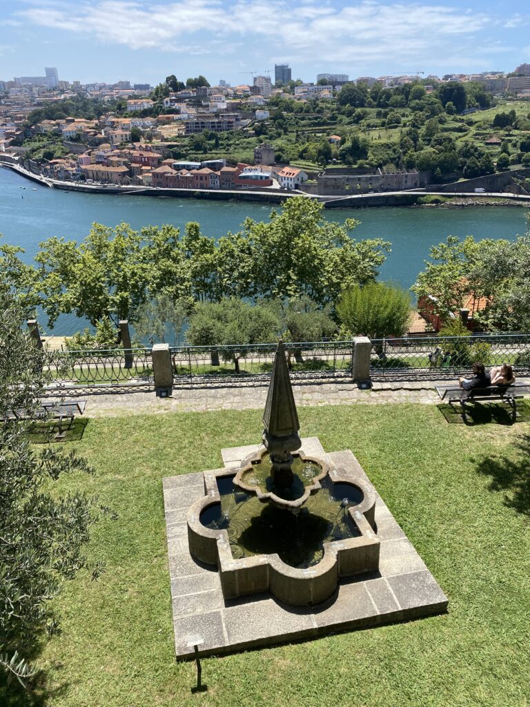 View of the Douro River and opposite coast from a grassy park with a 19th century fountain