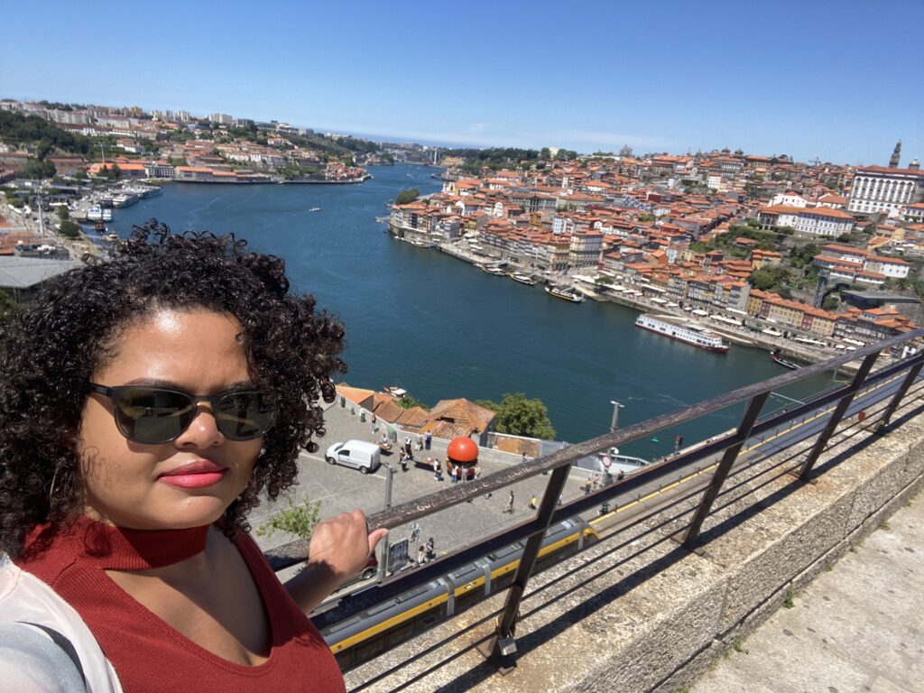Selfie of a woman overlooking the Douro River and city of Porto Portugal