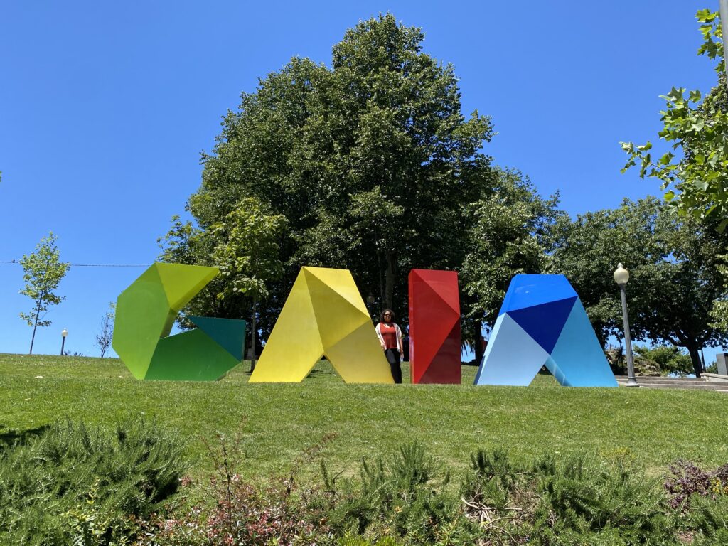 Colorful sculpture of the word Gaia placed in a park