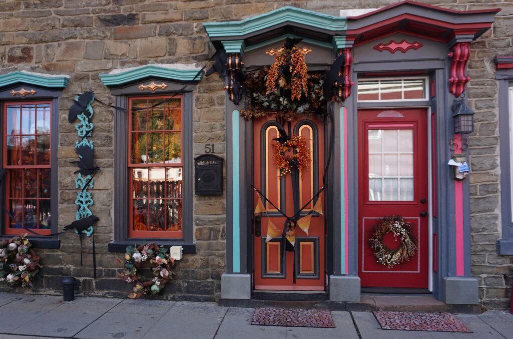 Colorful Halloween decorated doors on stone rowhomes in the Poconos Pennsylvania
