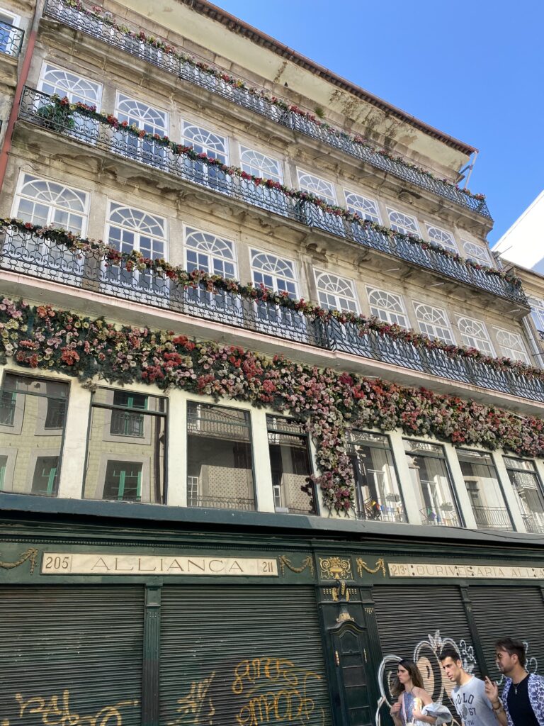Flowers decorating outside of building on Flowers Street in Porto Portugal