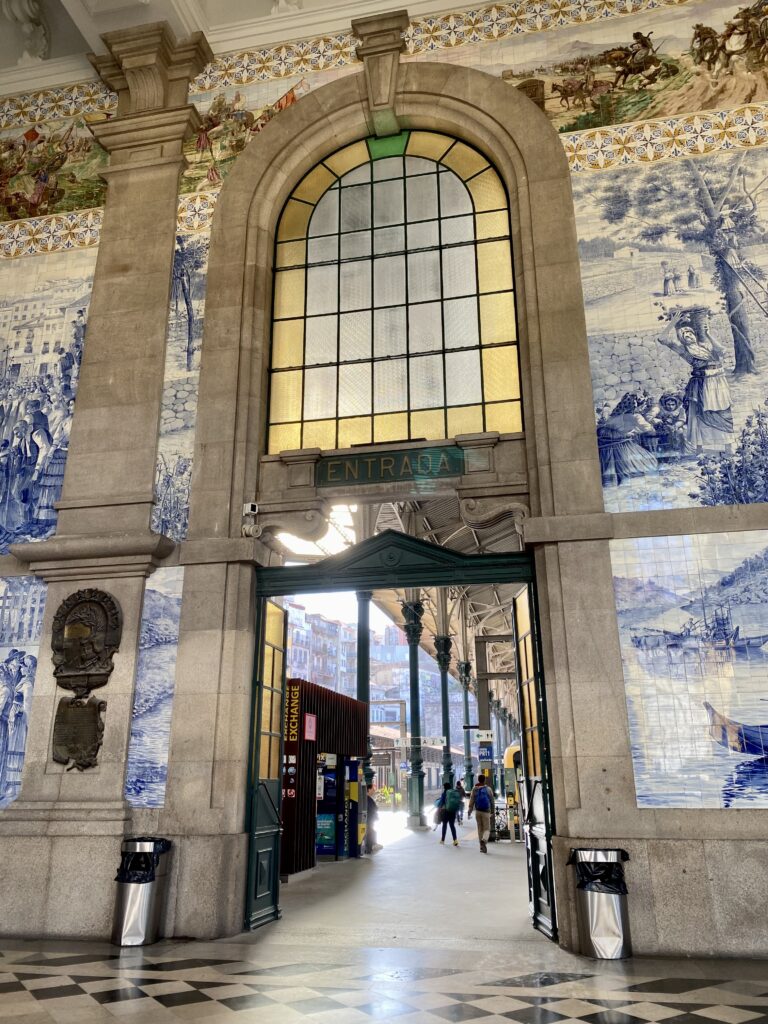Tile mural art on the wall of Porto train station entrance leading to the platform