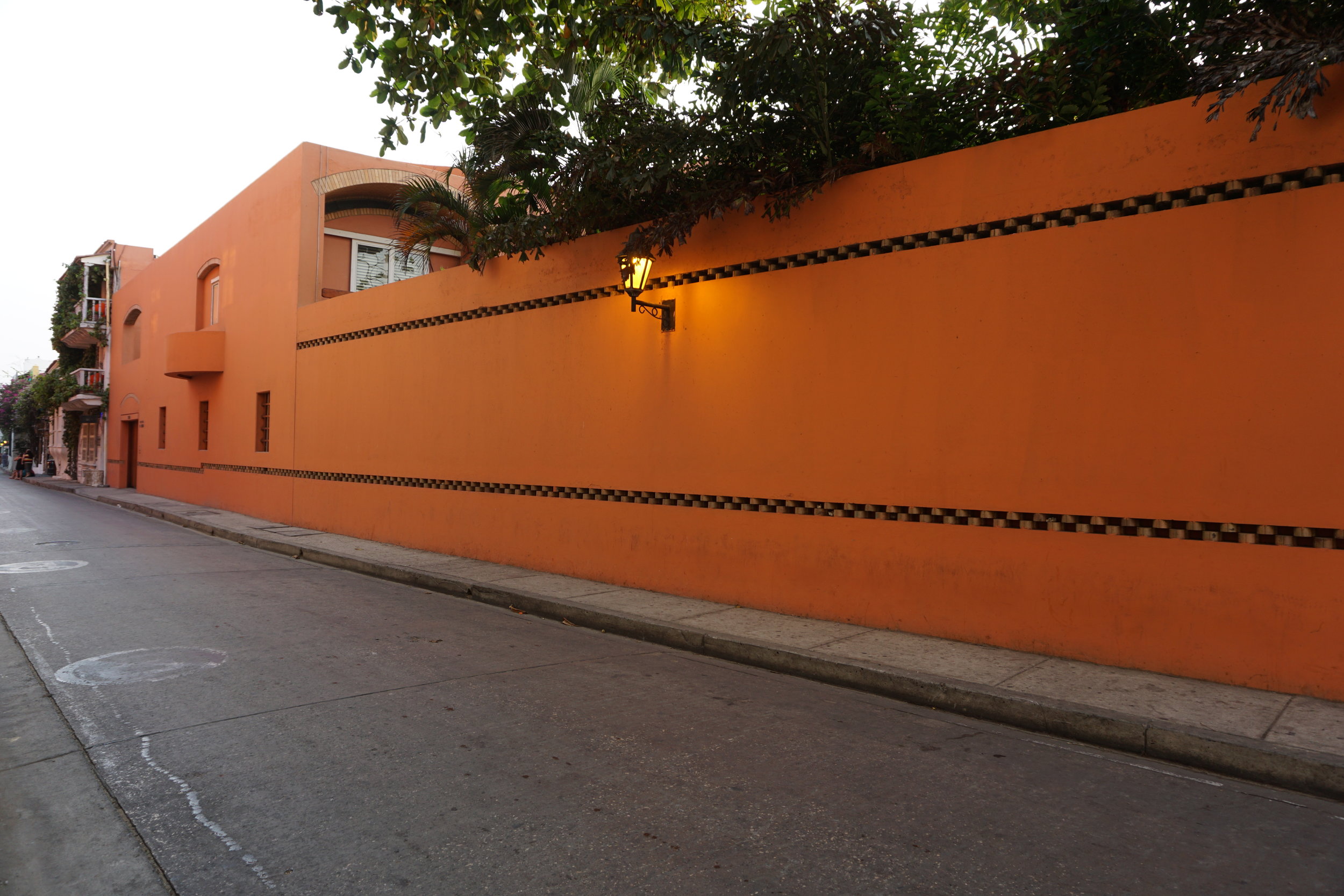 Orange outside wall of a large house in Cartagena Colombia