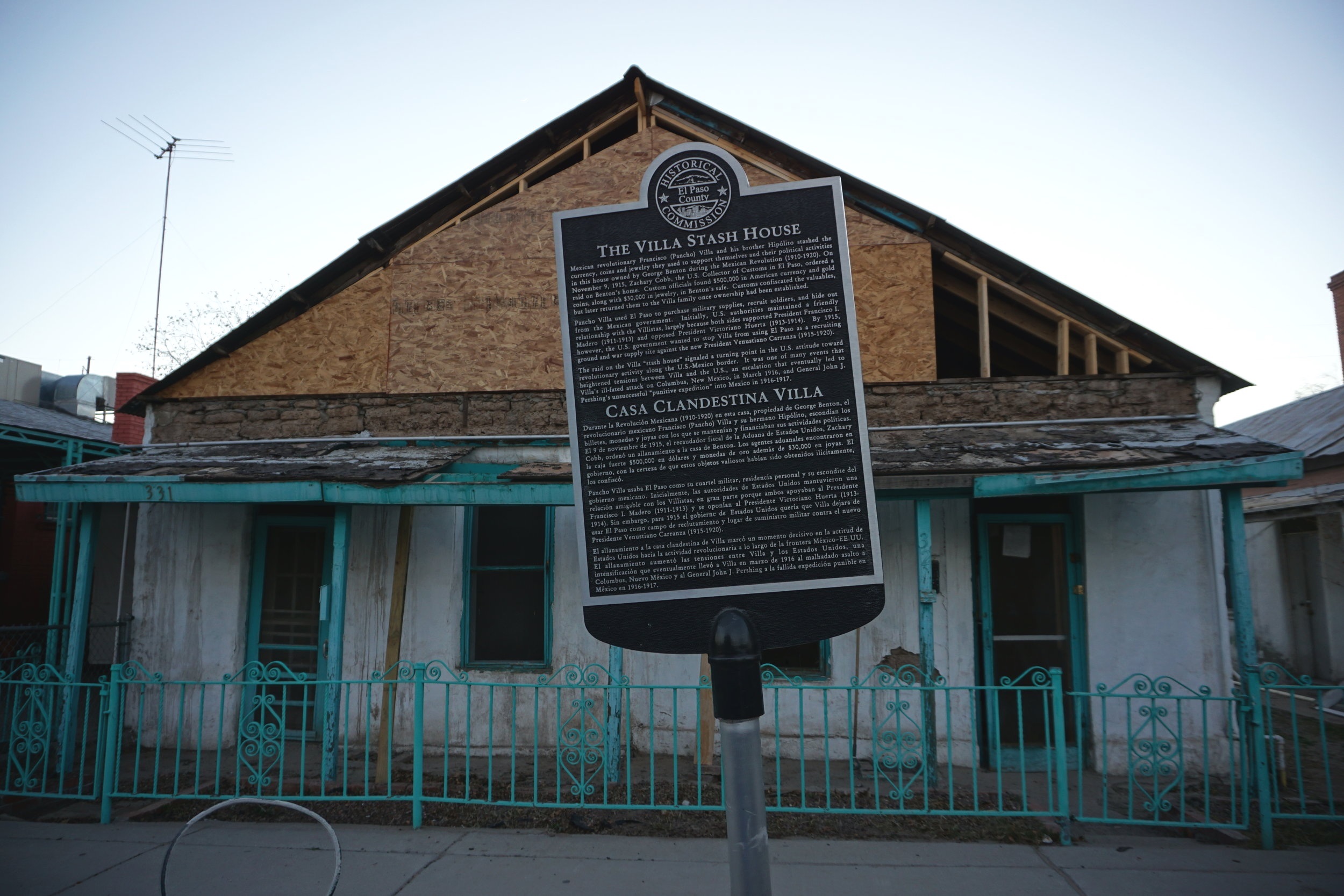 Rundown house with a commemorative plaque in front of it in El Paso Texas