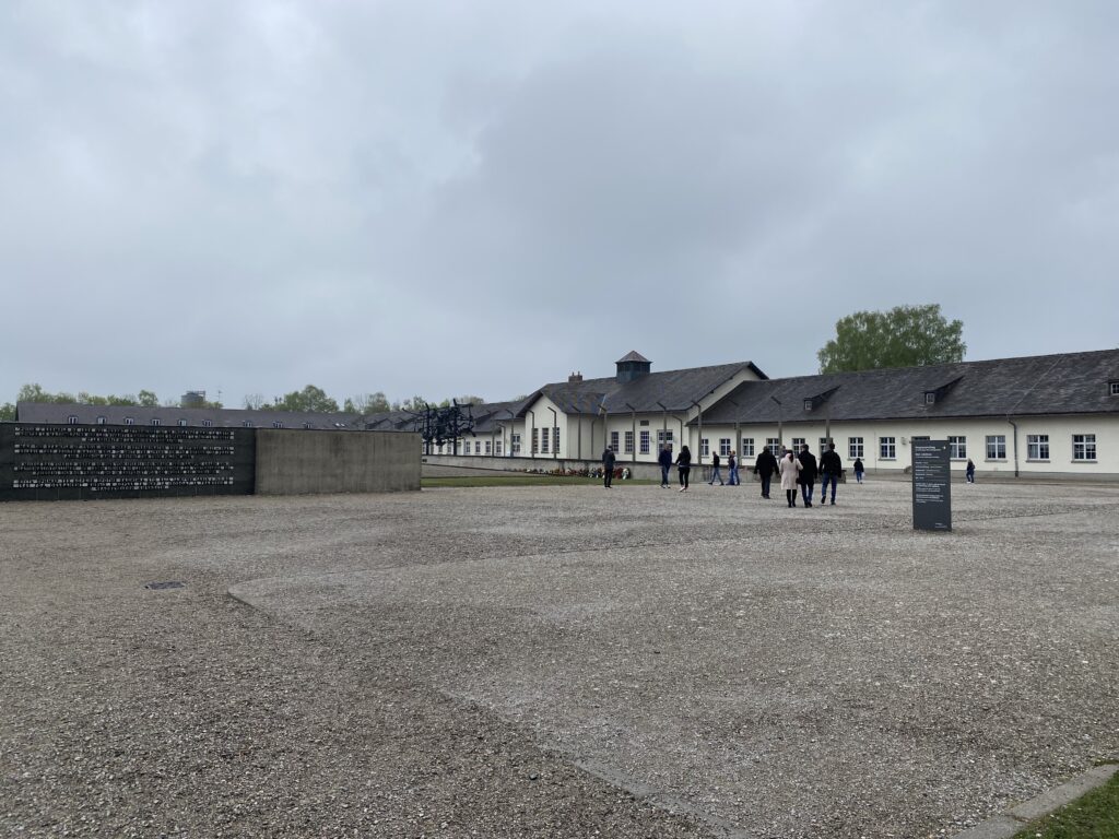 Gravel courtyard and long building of a former Nazi concentration camp