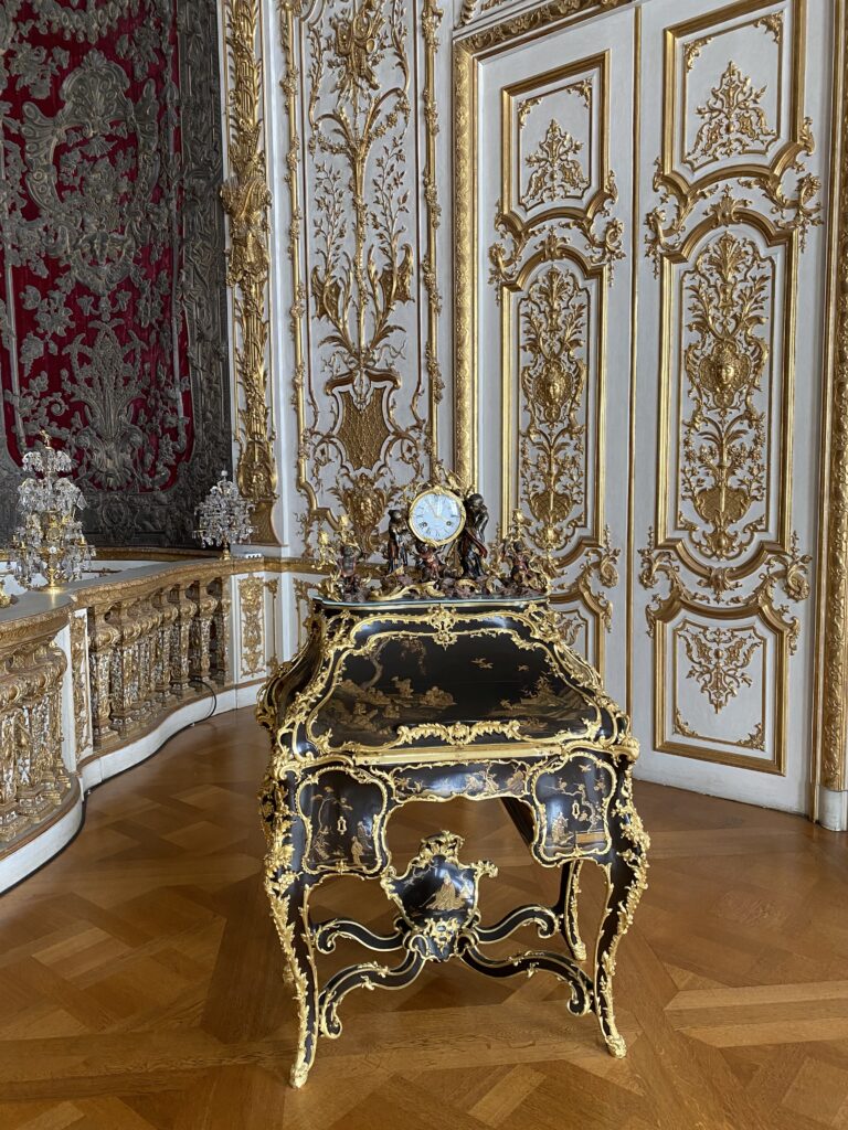 Gold and black ornate furniture piece in a Munich palace