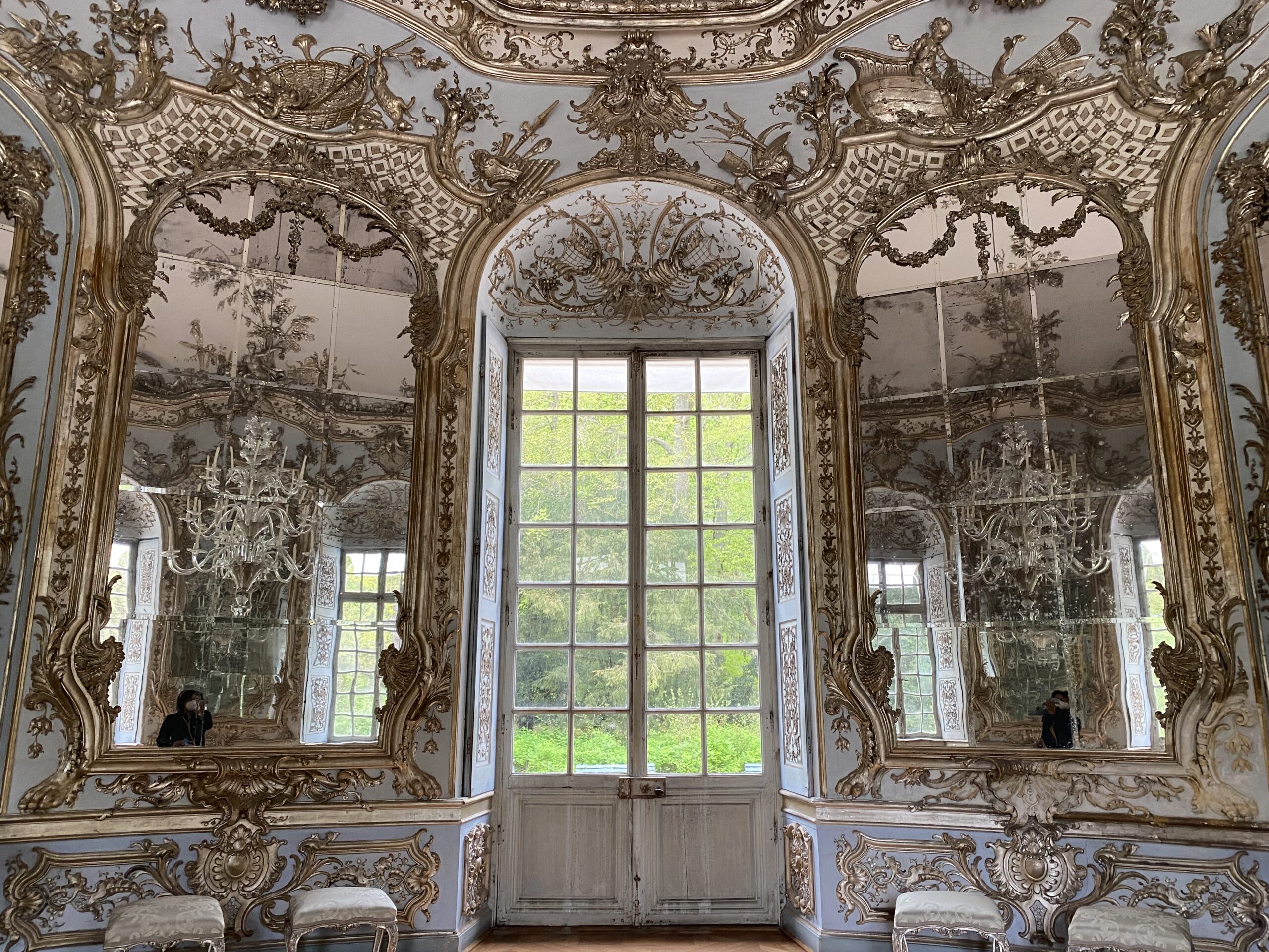 Elaborate wall and ceiling decorations in room of mirrors in a Munich Bavarian palace