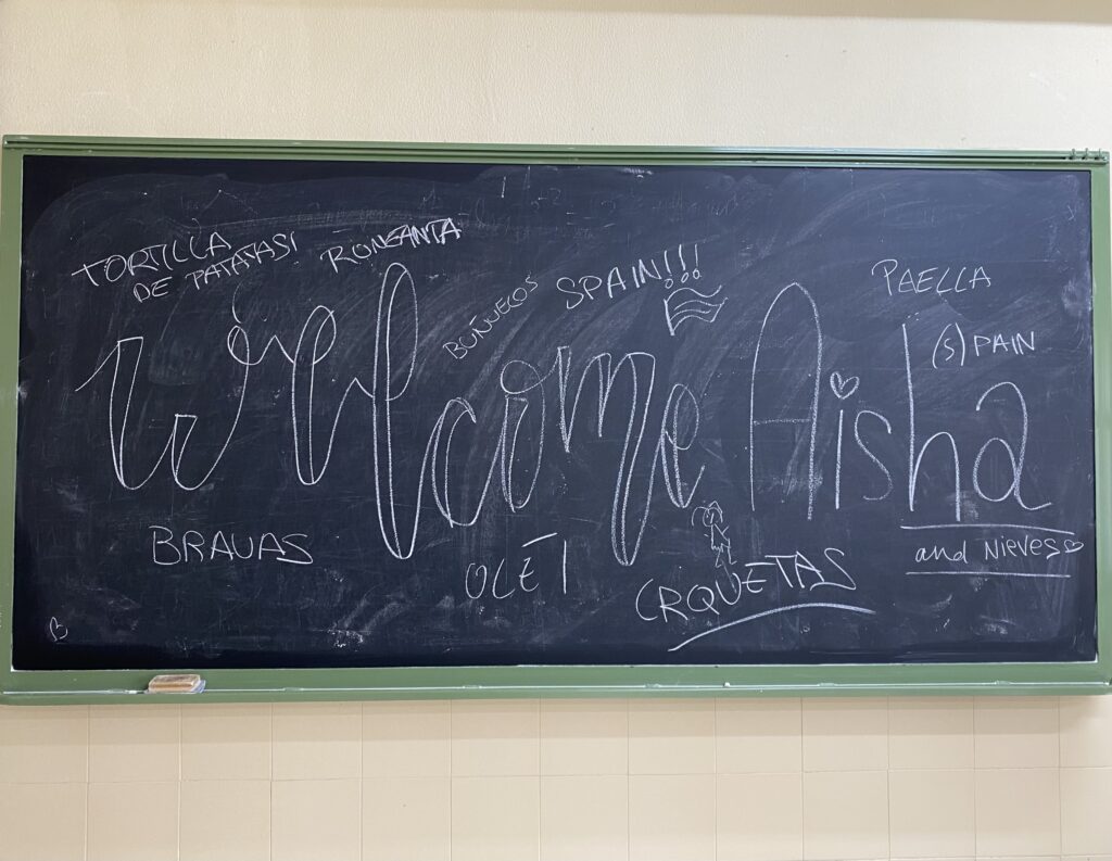 Chalkboard with writing and drawing on it for teaching English in Spain