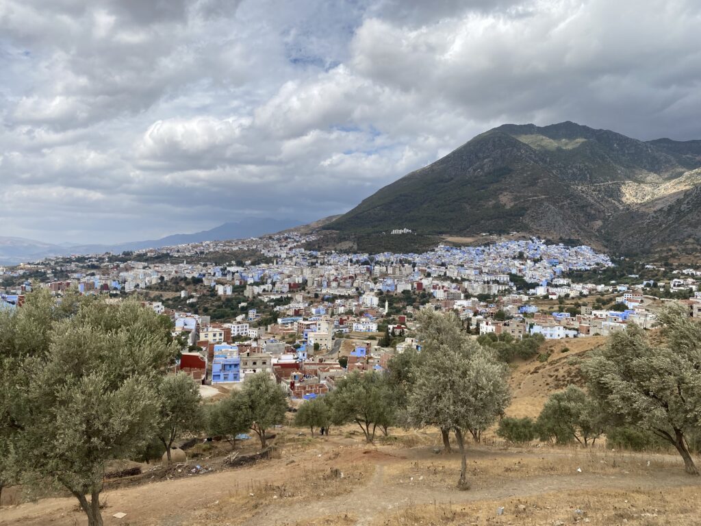 View of the Moroccan town of Chefchaouen at the foot of a mountain