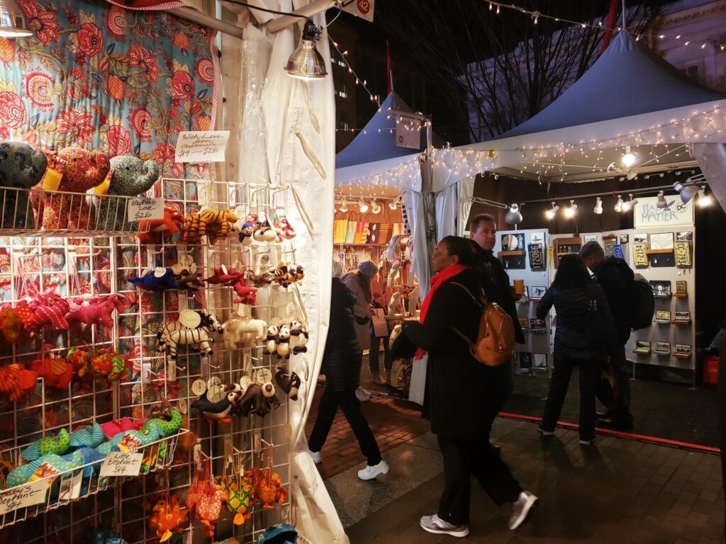 Shoppers walking through a holiday street market during Christmas in Washington DC