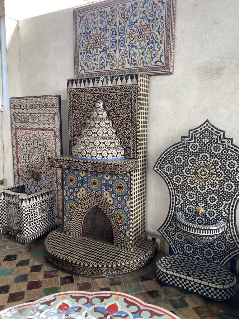 Display of completed tile mosaic fountains in a Fez Morocco pottery studio