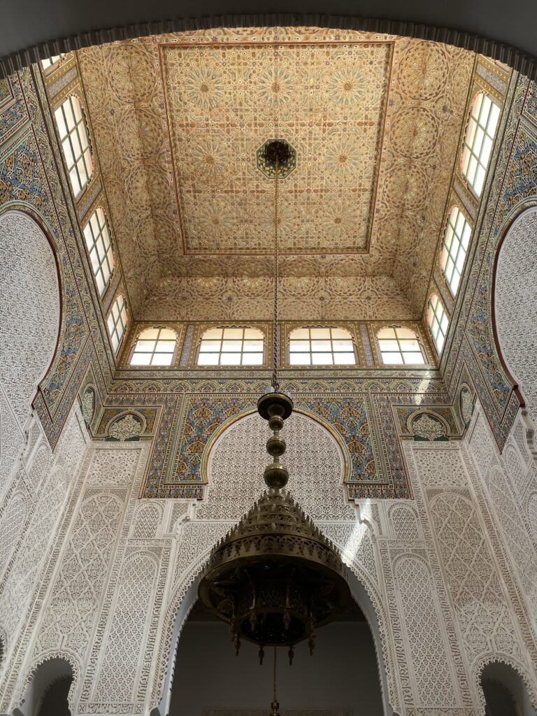Detailed Islamic artwork on ceiling of Moroccan former mosque