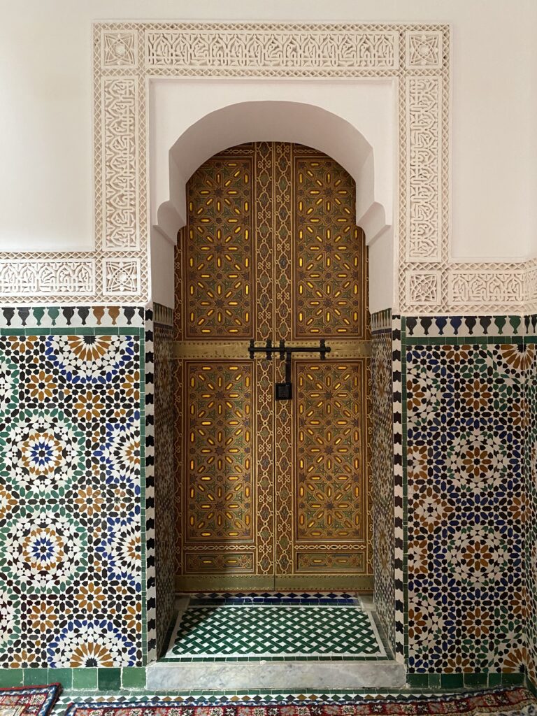 Wooden door decorated in Islamic style in a mausoleum and former mosque in Fez Morocco