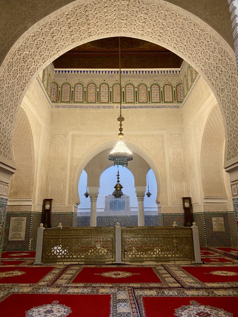 Tomb in the middle of a room in a former Moroccan mosque