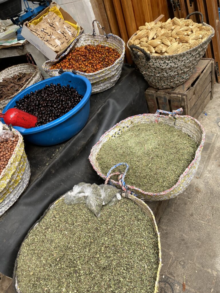 Spices in baskets being sold on street of Fez Morocco medina