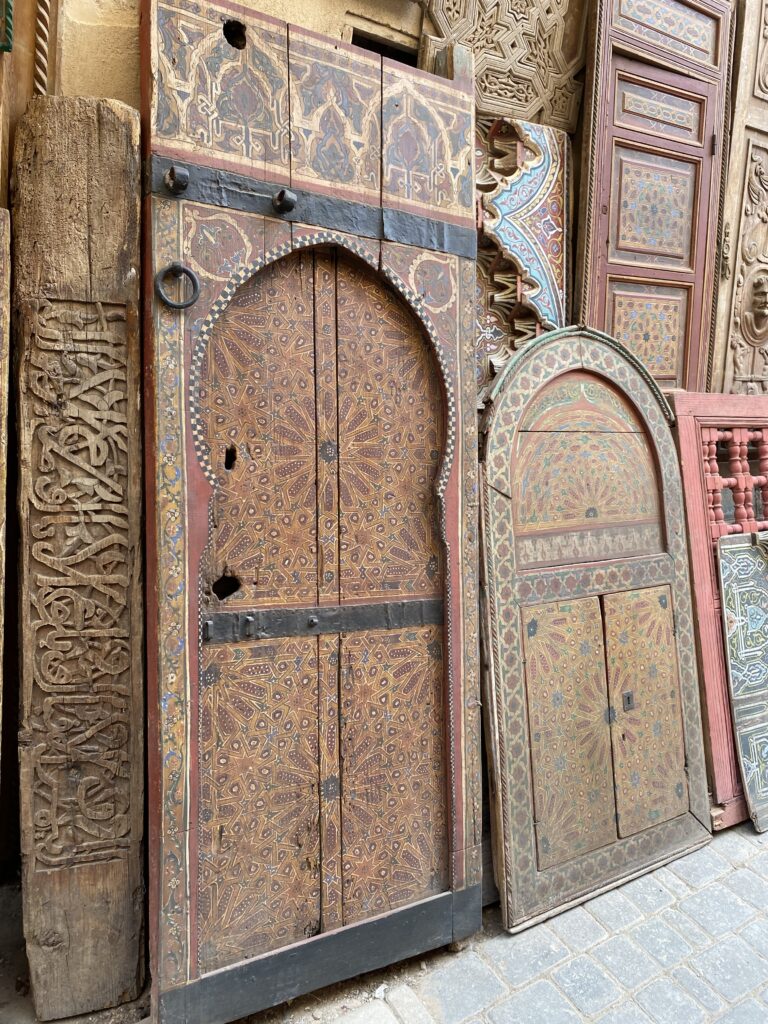 Shop display of wooden Moroccan doors