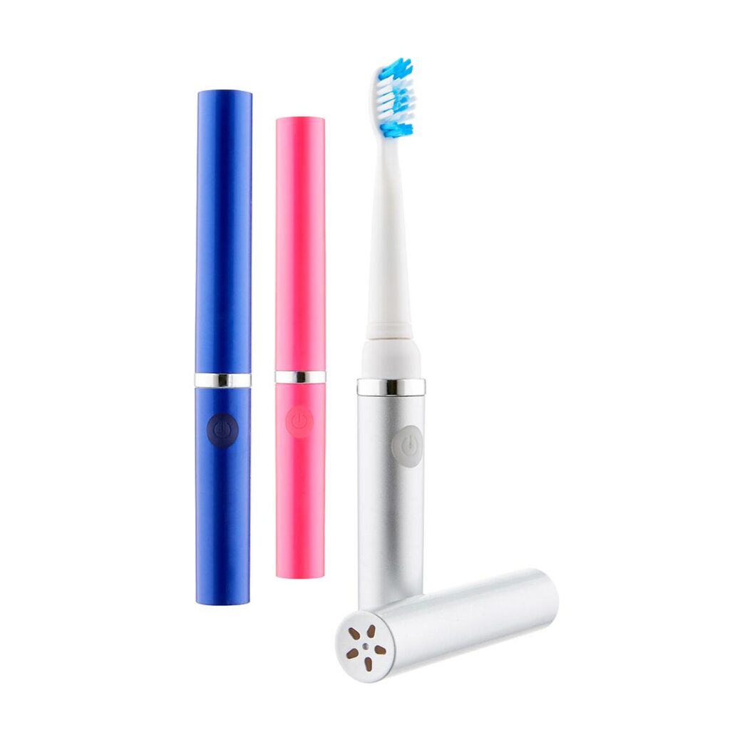 A blue, pink, and silver portable electric toothbrush for travel