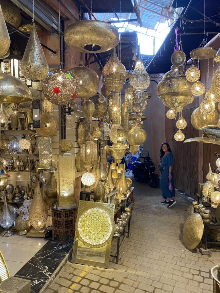 Golden metal lanterns hanging in shop in Marrakesh medina