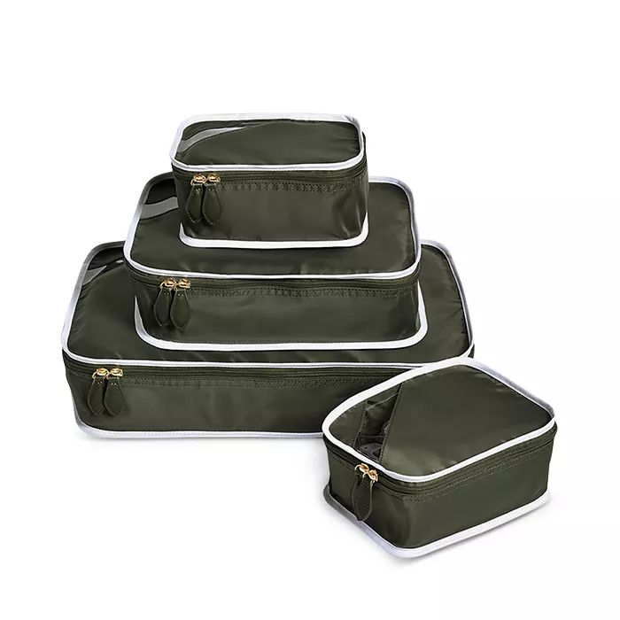 Set of four olive green and white packing cubes