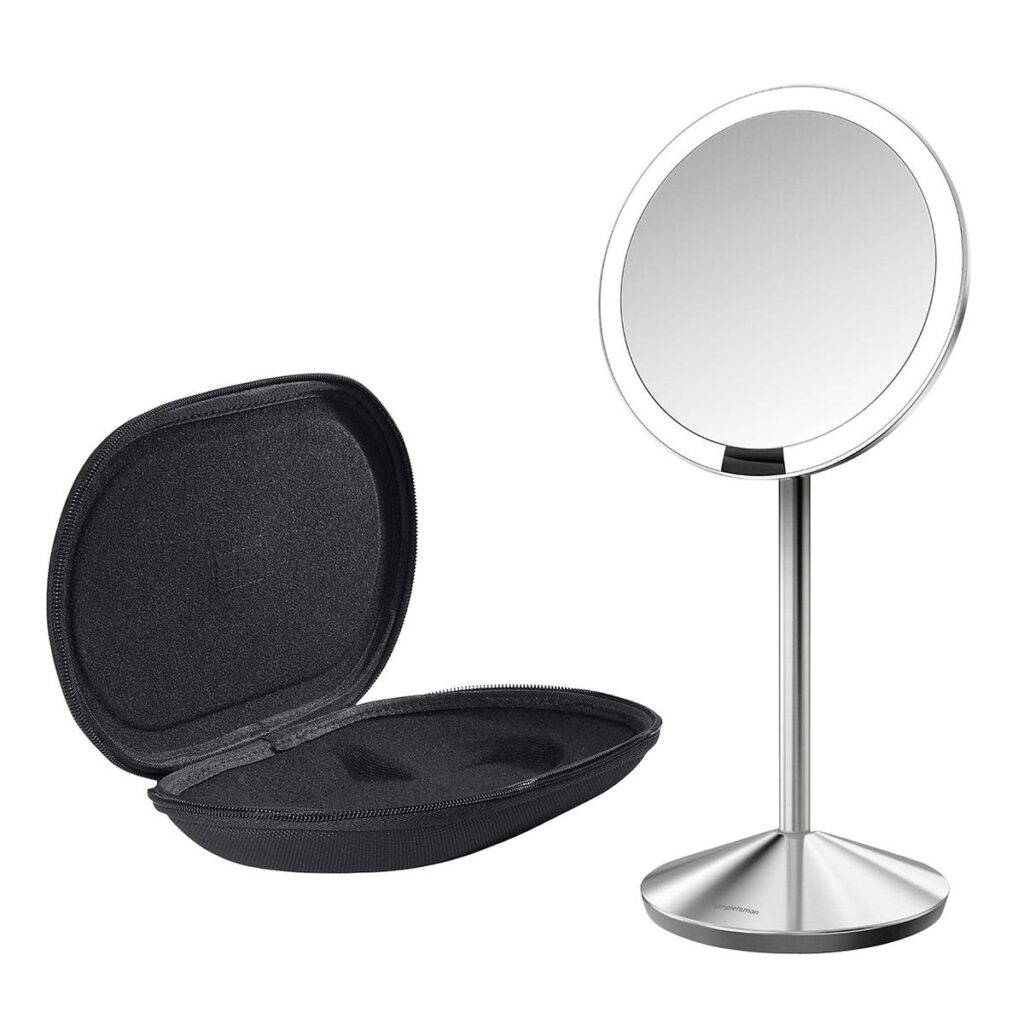 A silver makeup mirror with LED light and its black padded carrying case