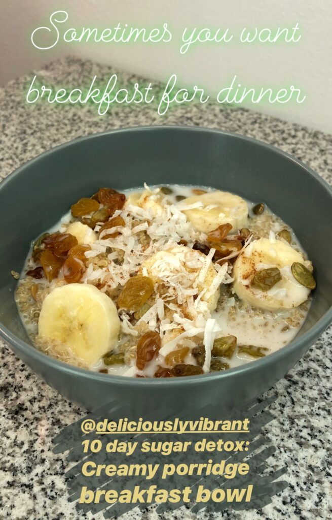 Healthy breakfast bowl containing banana slices, oats, seeds, shredded coconut, and raisins