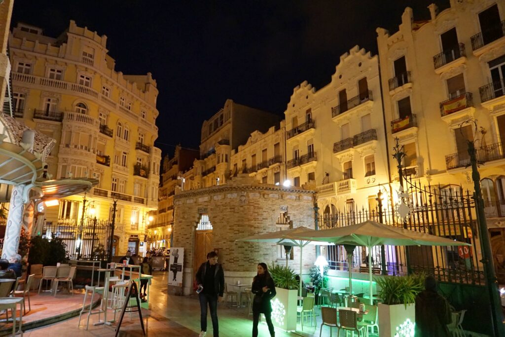 Outdoor patio area of a market in Valencia Spain surrounded by Art Nouveau-style buildings