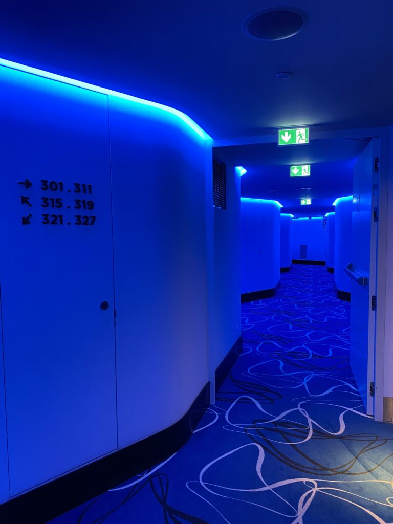 Hotel hallway in blue fluorescent lights