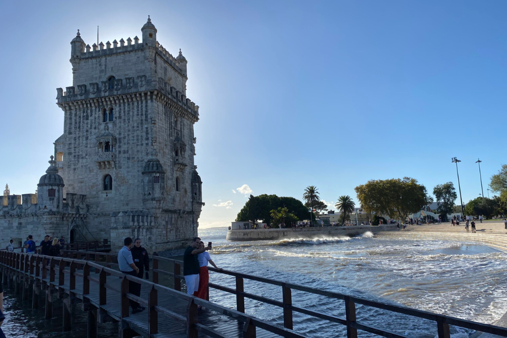 Tower on a Lisbon shore with wooden bridge leading to it