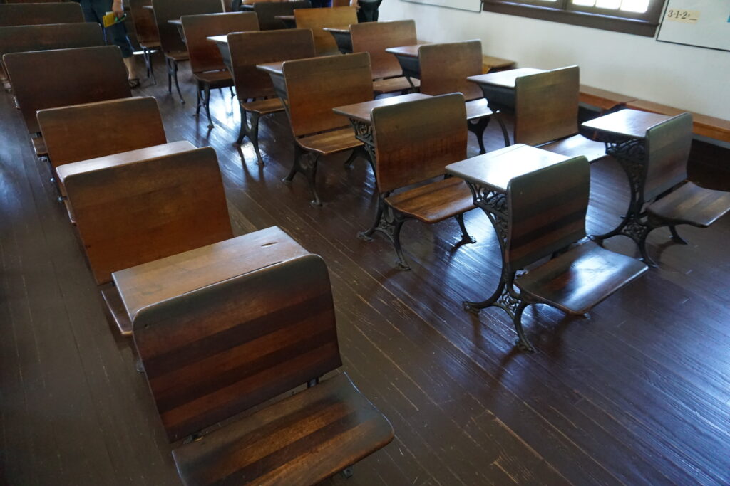 Student chairs and desks inside an Amish one-room schoolhouse