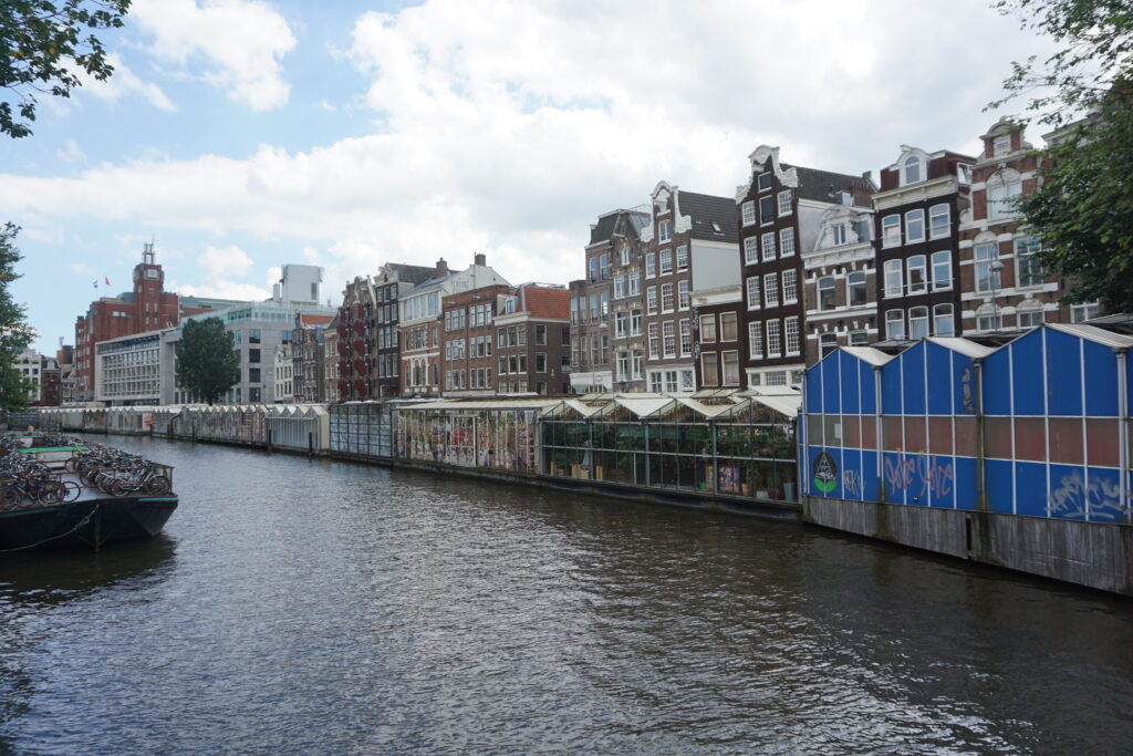 Row of floating flower shops along a canal