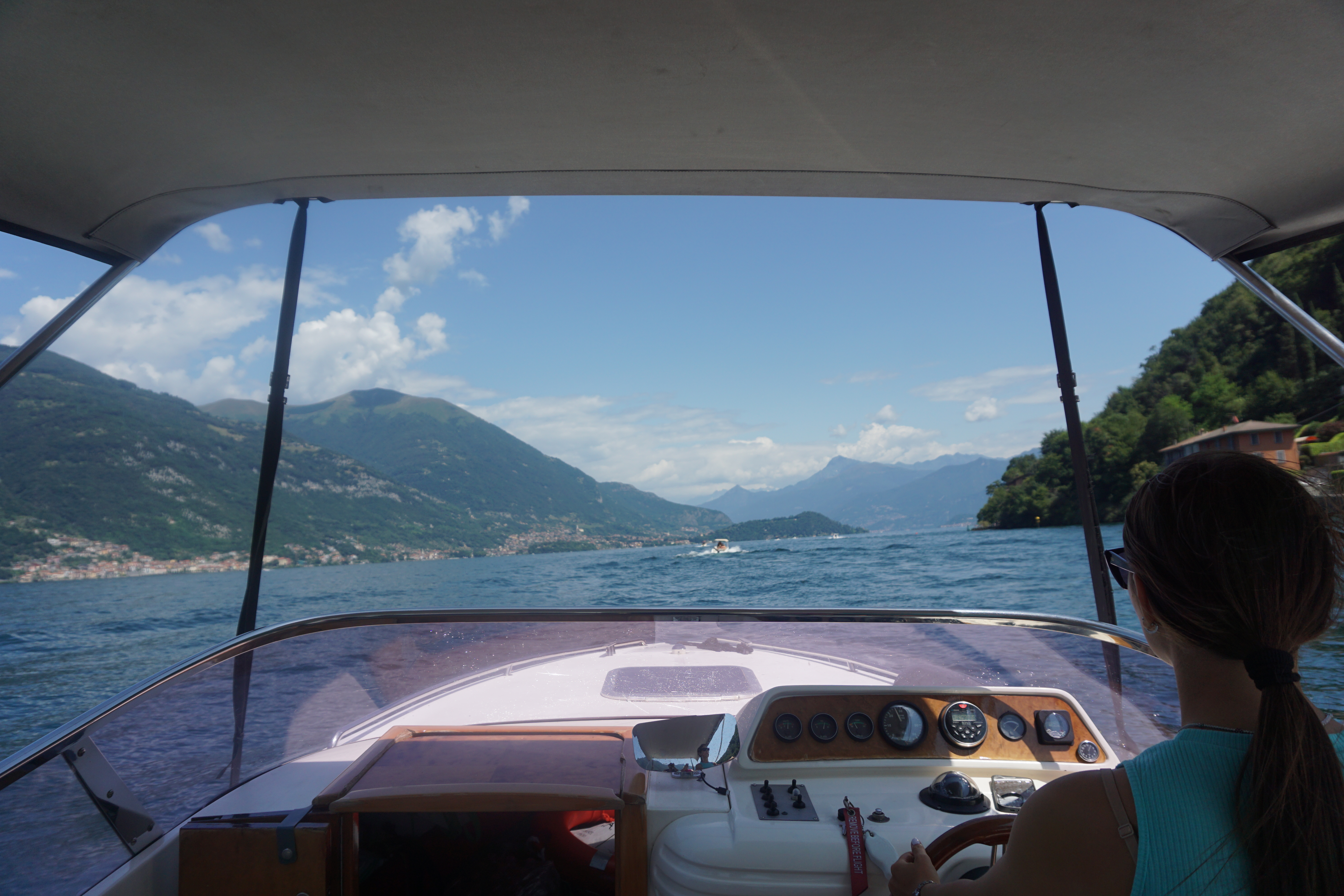 View of mountains out of the front of a boat on Lake Como Italy