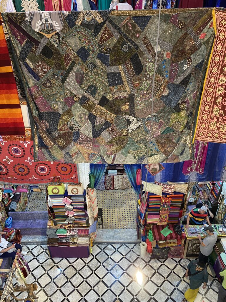 Rugs and other textiles on display in Morocco shop