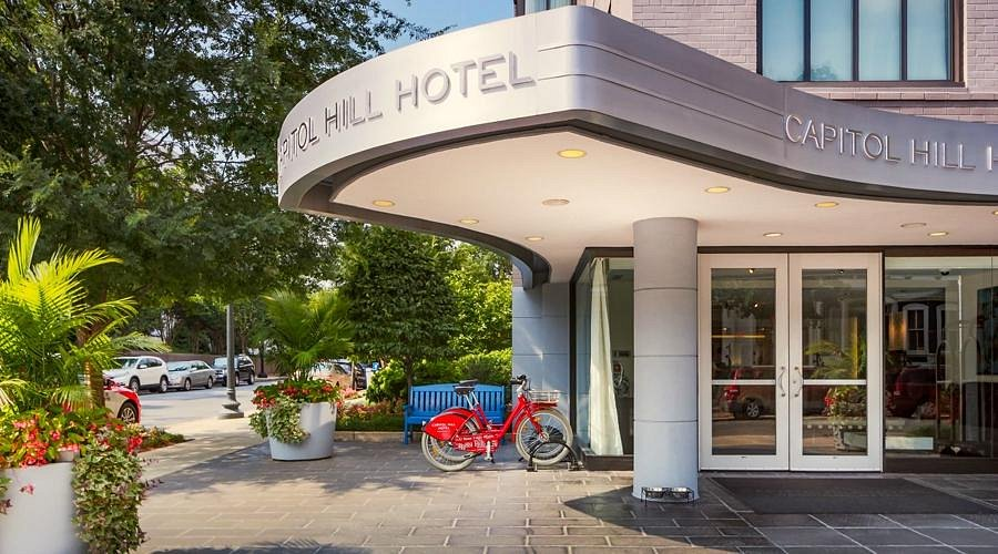 Front of the Capitol Hill Hotel on a DC city street with bicycles parked in front